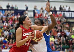 Canada's Natalie Achonwa, left, elbows Cuba's Clenia Noblet Salazar during first half action of the 2015 FIBA Americas Women's Championship Final in Edmonton, Alta., on Sunday, August 16, 2015. THE CANADIAN PRESS/Jason Franson