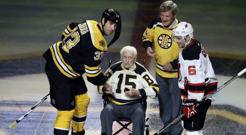 Boston Bruins defenseman Zdeno Chara (33) and New Jersey Devils defenseman Andy Greene (6) participate with Bruins legends Milt Schmidt (15) and Bobby Orr in a ceremonial puck drop before an NHL hockey game, Thursday, Oct. 20, 2016, in Boston. (Elise Amendola/AP)